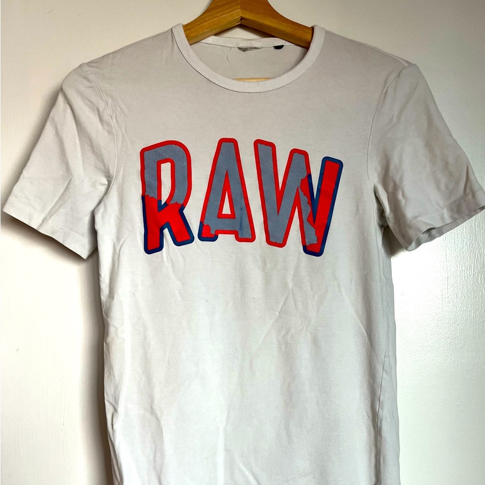 White G-Star t-shirt with Orange & Blue RAW logo. Gently used. Size/ Men’s Small